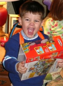 Child-at-Christmas-excited-about-opening-a-present1